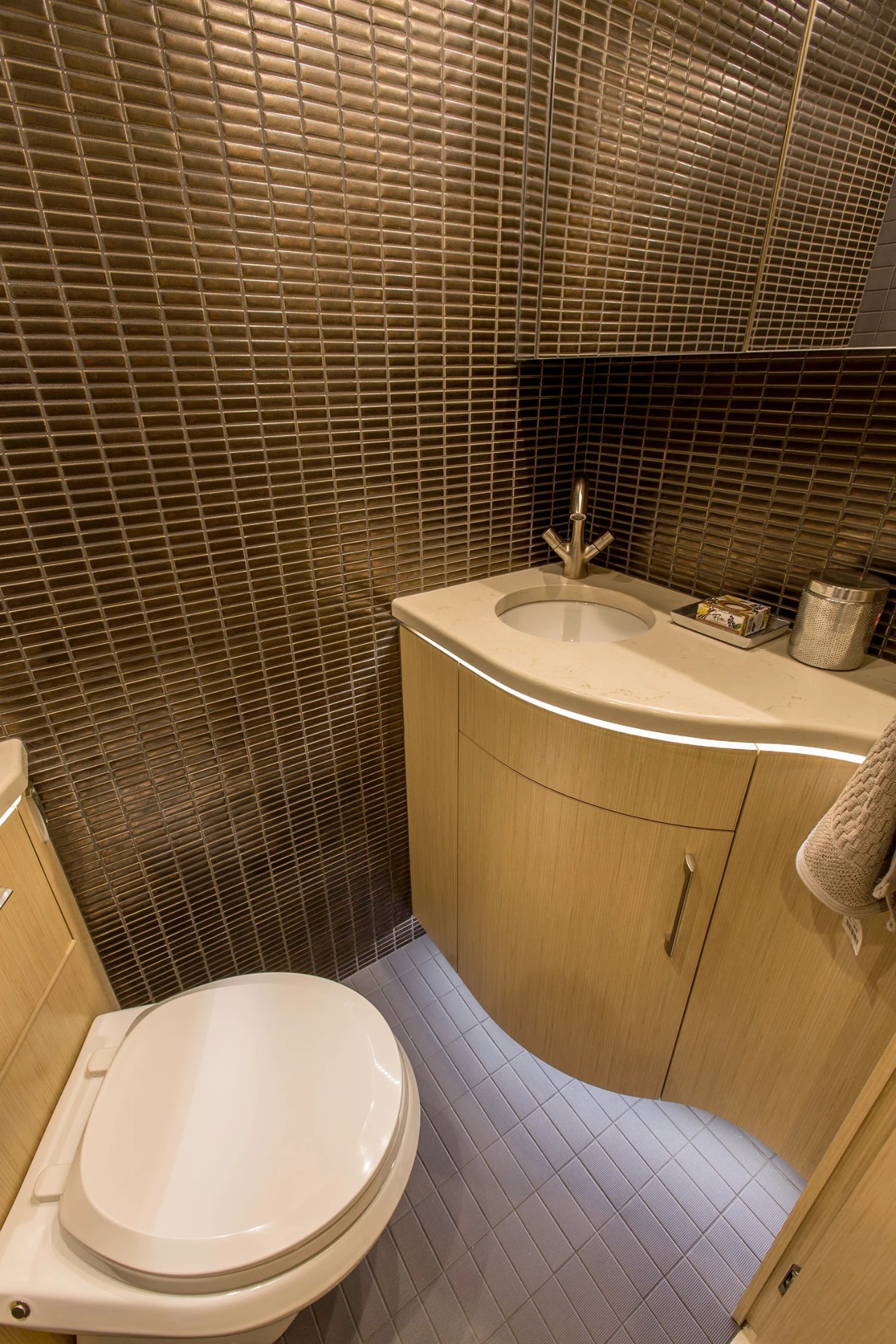 Powder room with mosaic tile detail